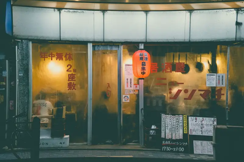 Cozy izakaya with warm lighting in Kyoto, Japan, showcasing traditional decor.