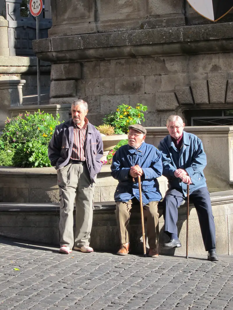 Men hanging out in Soriano's piazza
