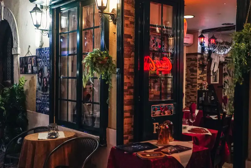 Intimate dining setting in a warm, cozy indoor restaurant with vibrant decor.